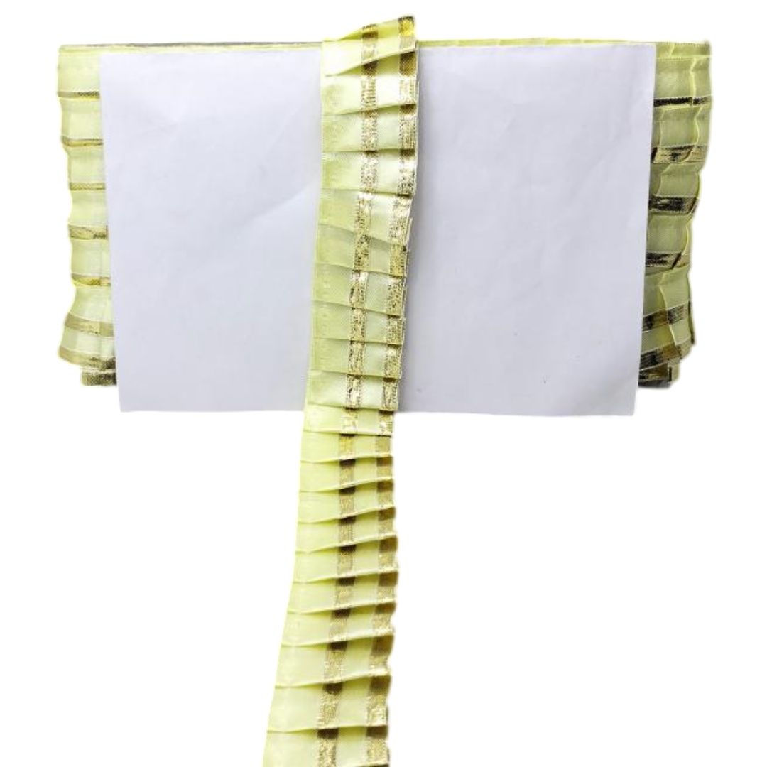 White napkin with green decorative border on a white background