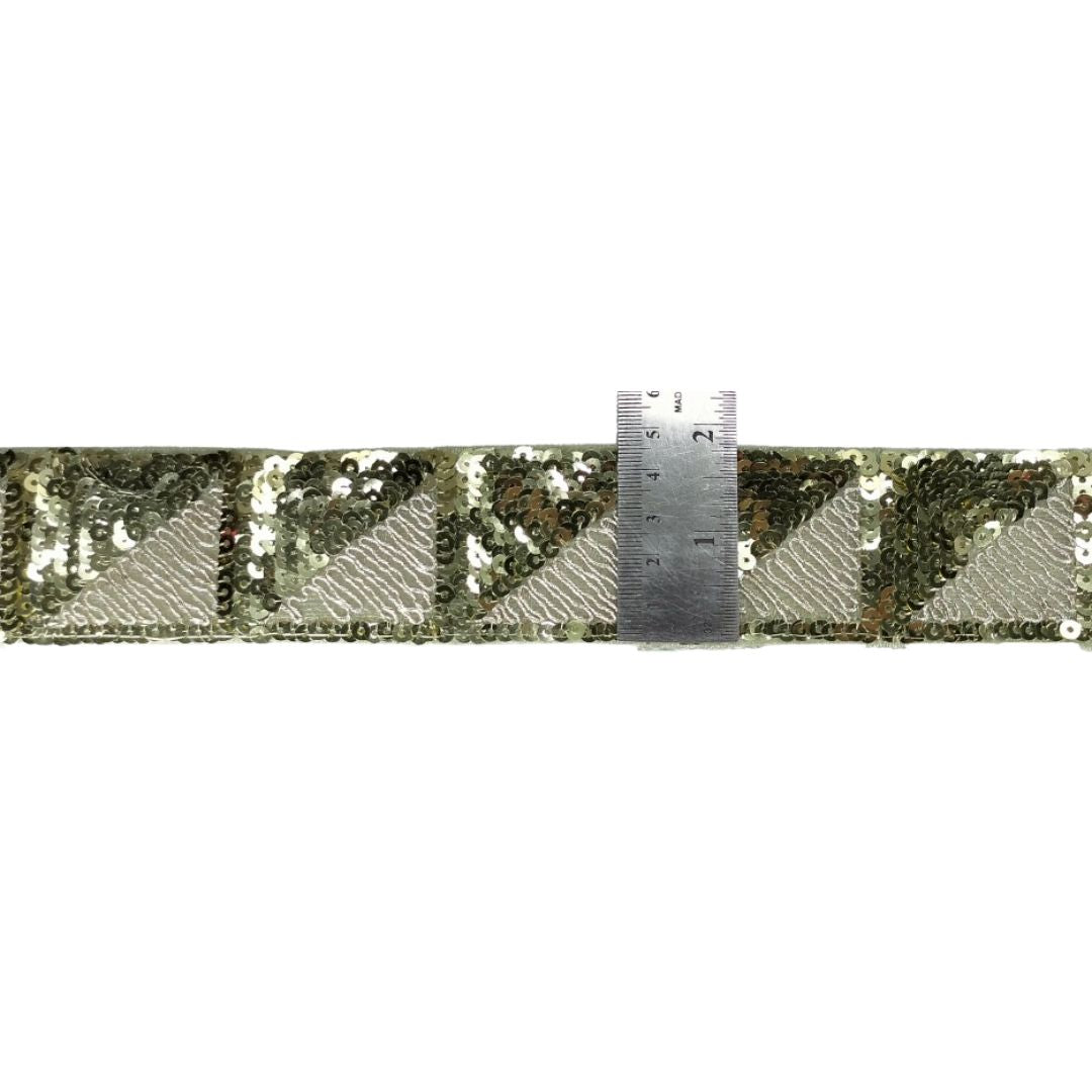 Sequined ribbon with a ruler for measurement on a white background