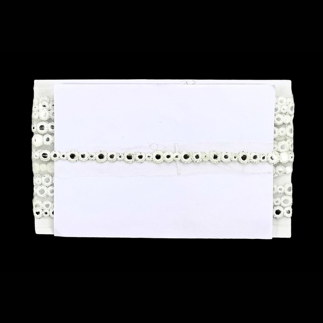 White envelope with decorative lace border on a white background
