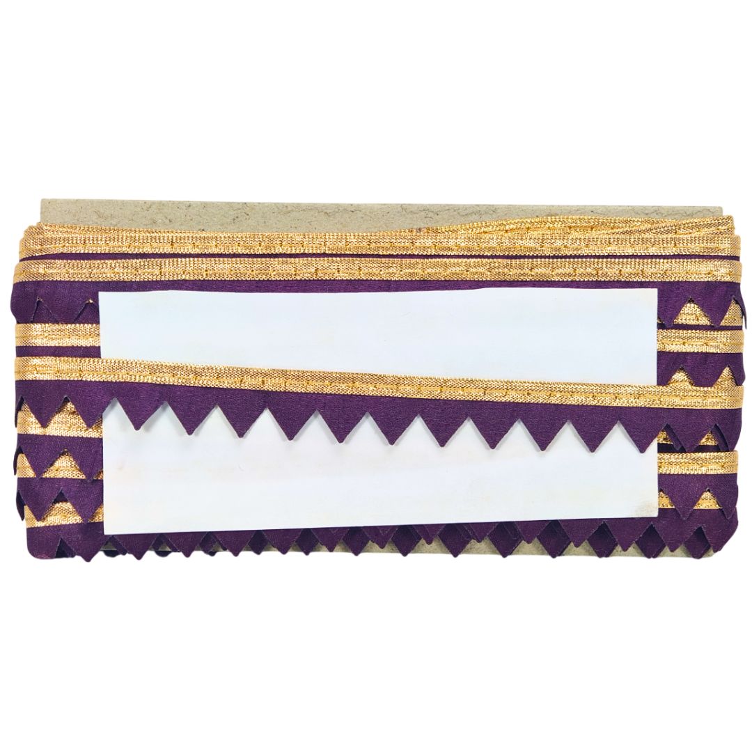Decorative purple and gold clutch bag on a white background