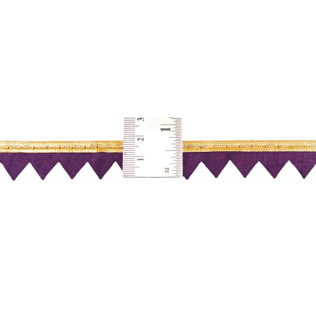Purple and gold border with a ruler for scale on a white background