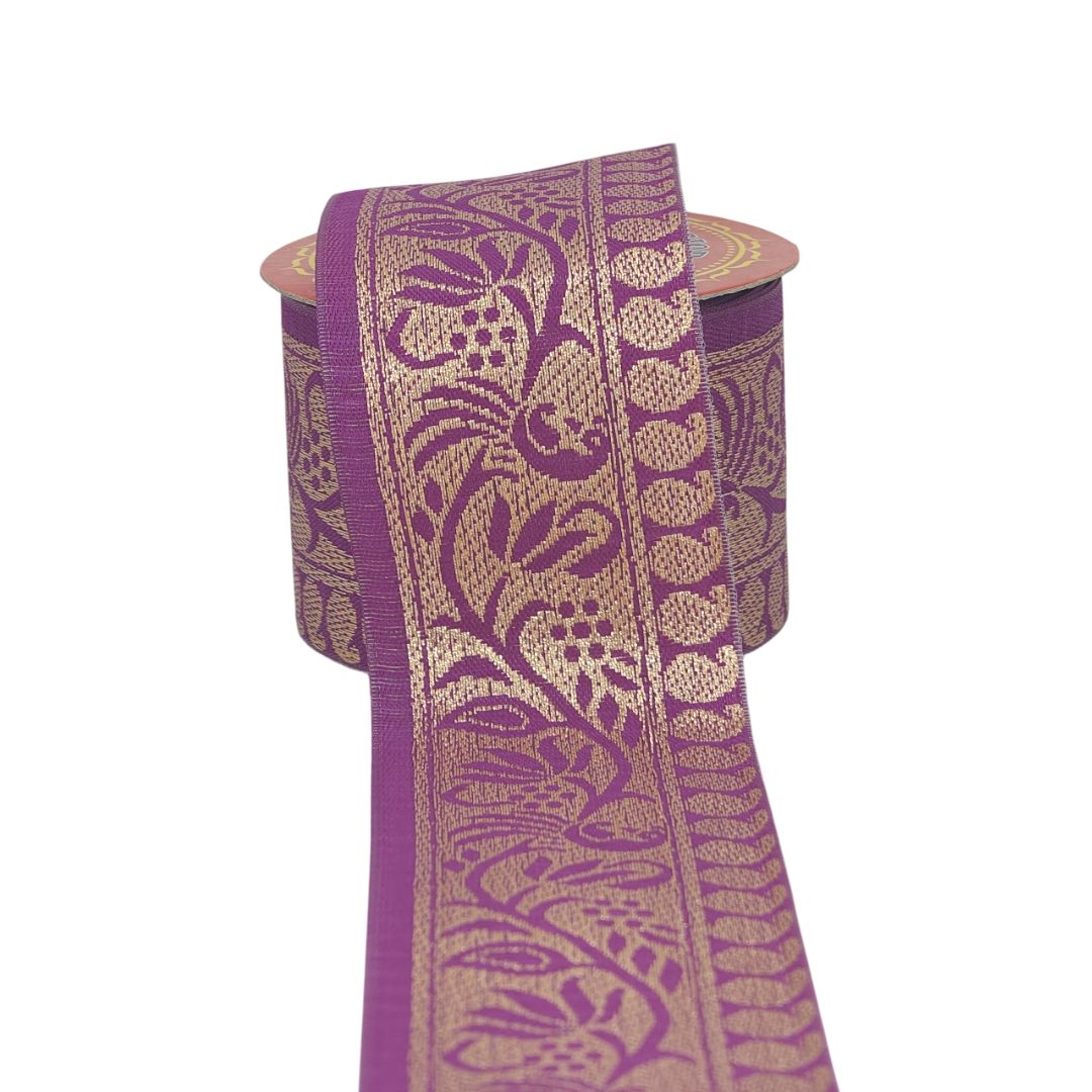 Purple and gold patterned fabric on a white background