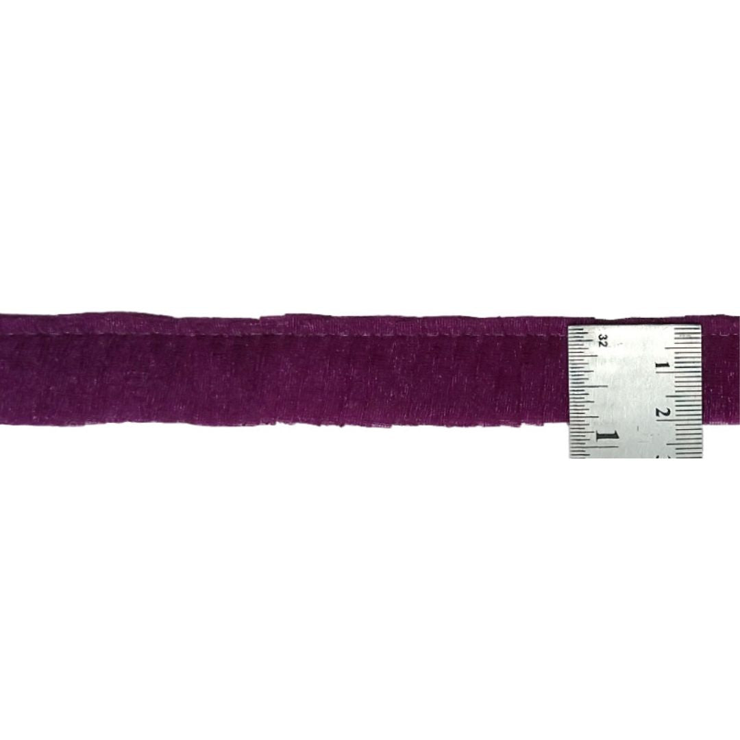 Purple belt with a silver measuring tape on a white background