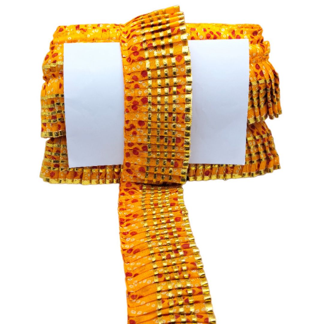 Yellow patterned fabric with a white card on a white background