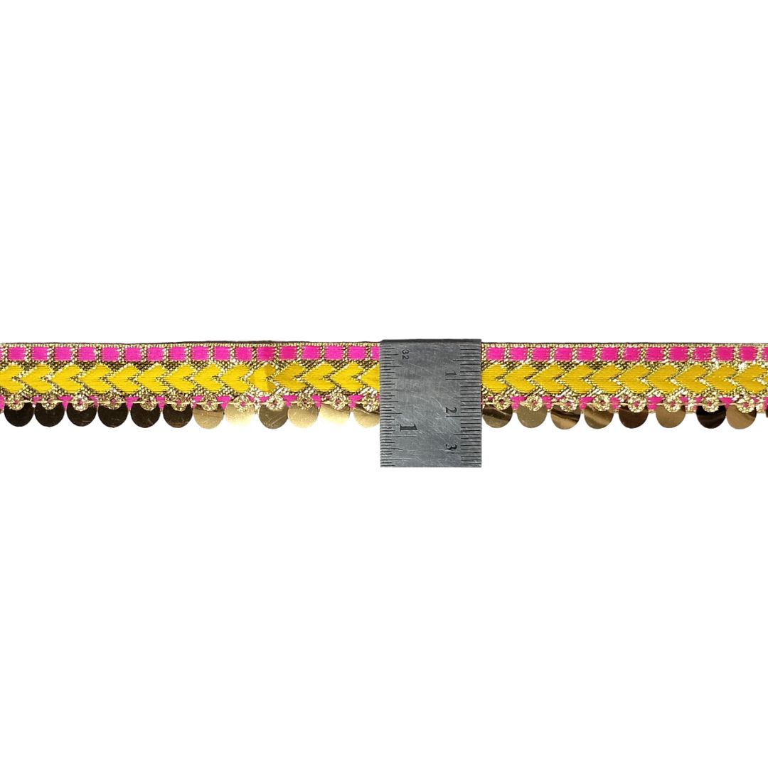 Decorative border with yellow and pink pattern and a ruler for scale on a white background