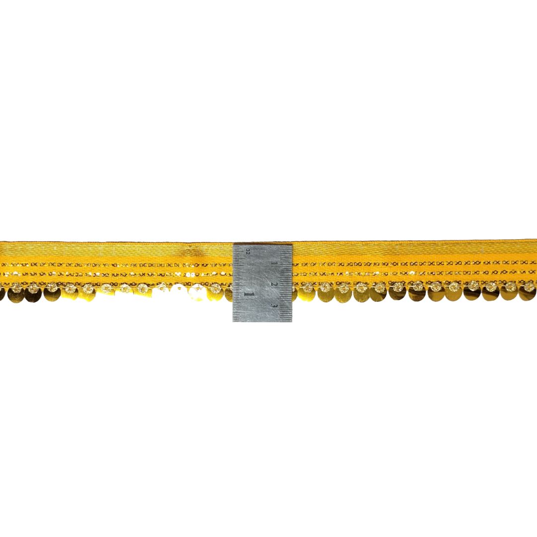 Decorative yellow trim with beads on a white background