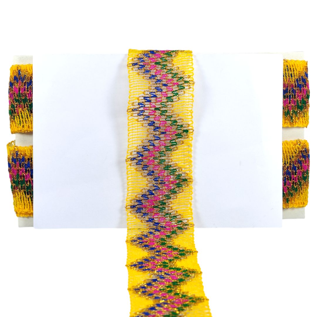 Colorful beaded bracelet with a zigzag pattern on a white background