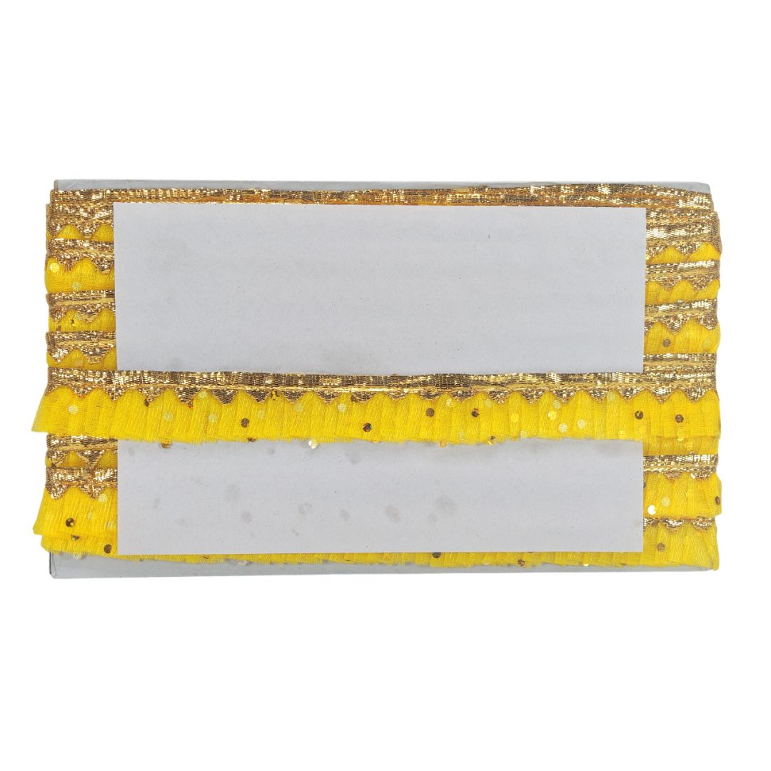 Yellow clutch with gold accents on a white background