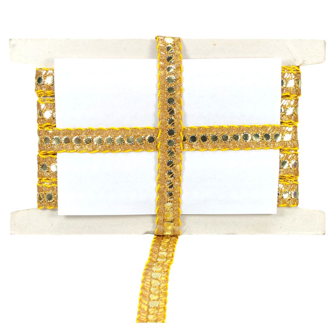 Decorative item with gold and white design on a white background