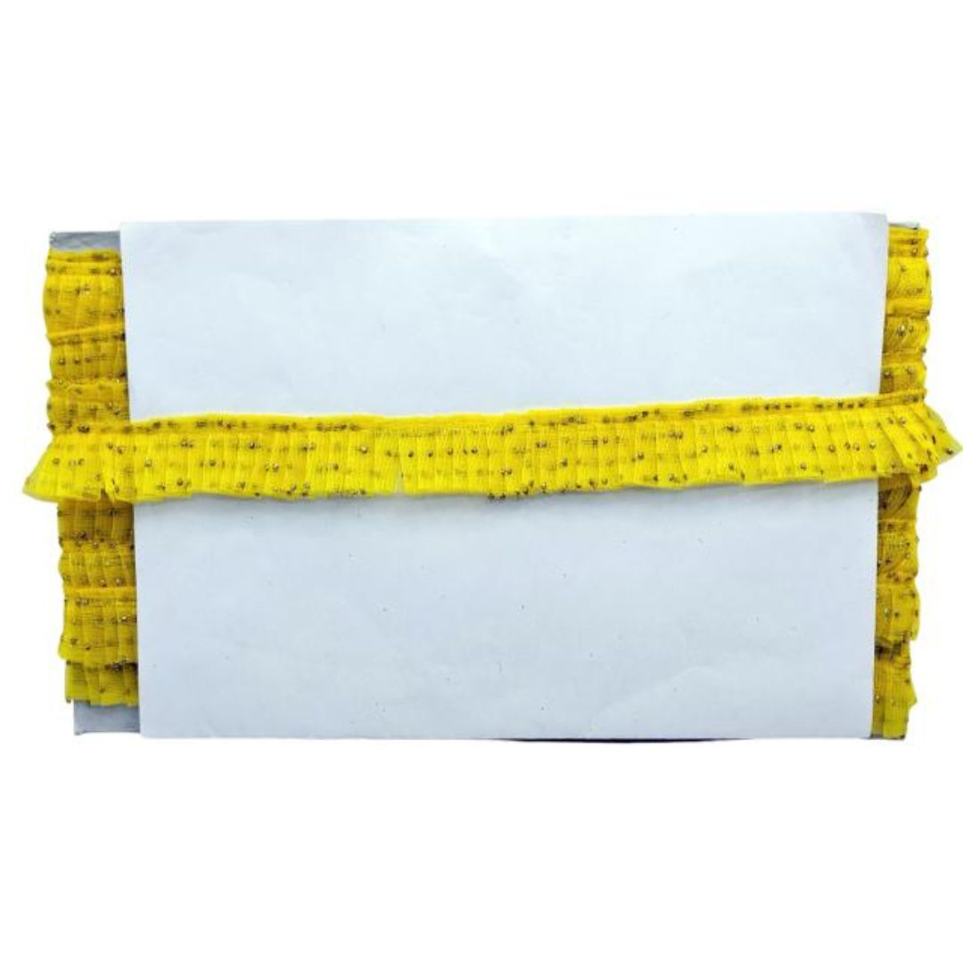 White clutch with yellow textured trim on a white background