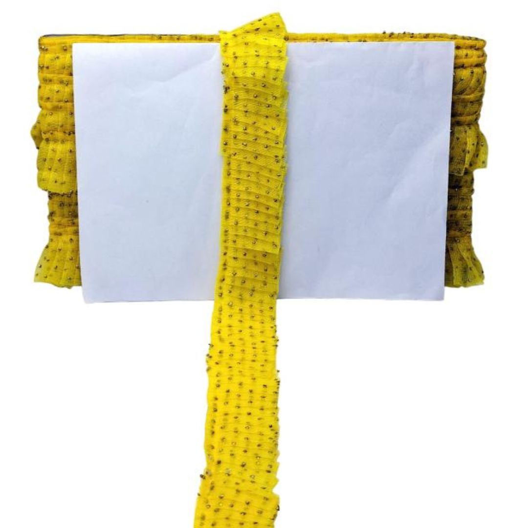 Yellow fabric with black patterns on a white background