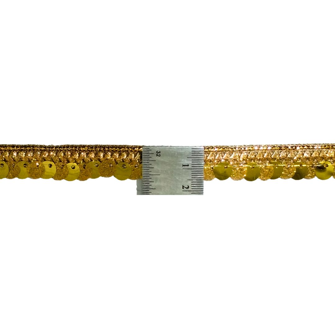 Gold trim with a ruler for measurement on a white background