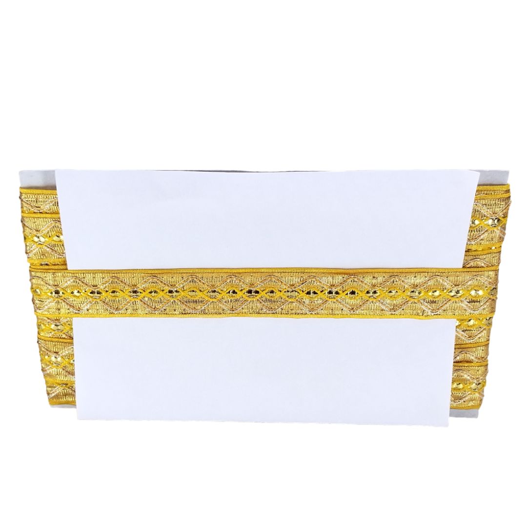 White tablecloth with gold decorative border on a white background
