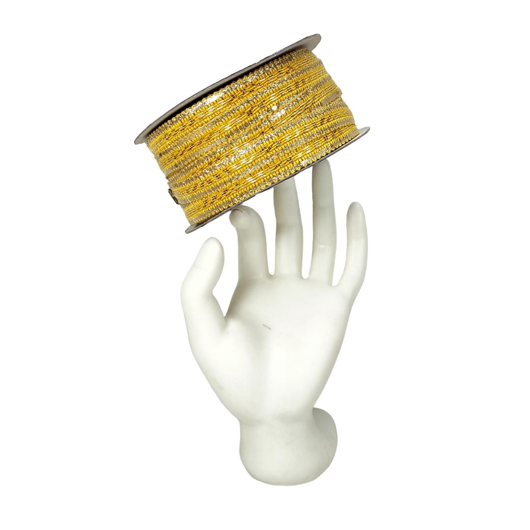 Spool of yellow ribbon on a white mannequin hand