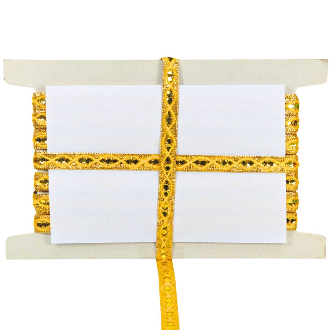 Decorative yellow ribbon with intricate patterns on a white background