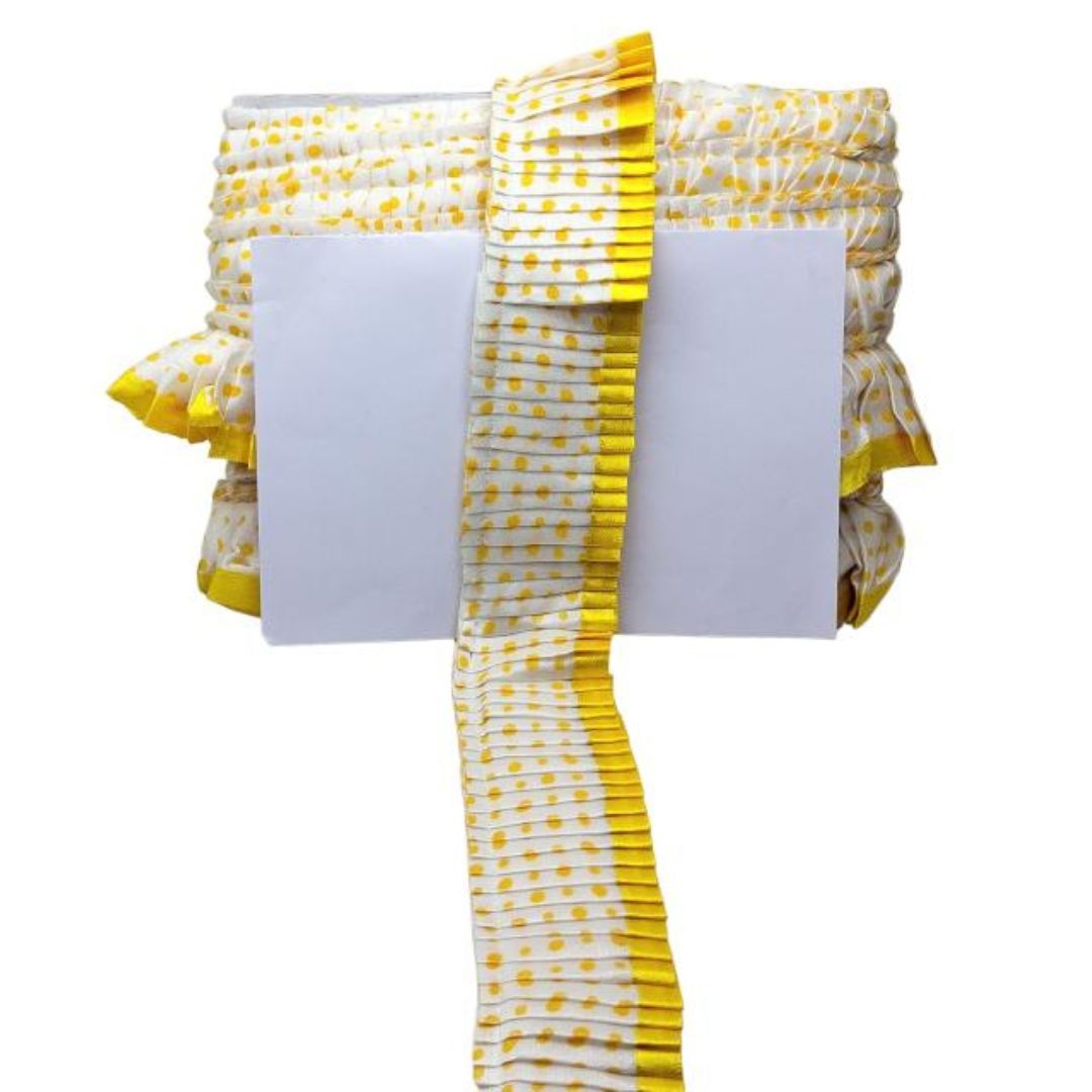 White fabric with yellow pattern on a white background