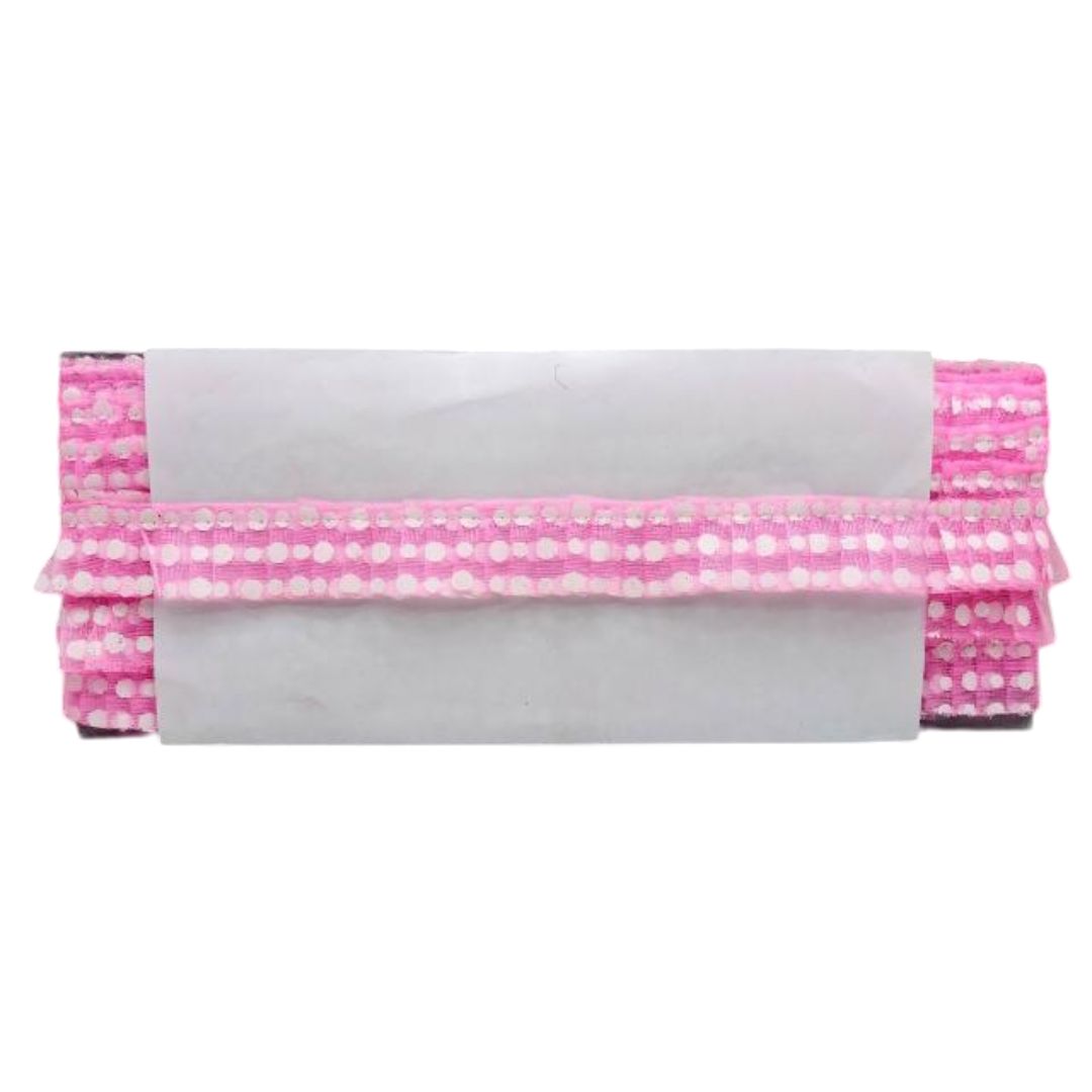 Pink polka dot clutch bag on a white background