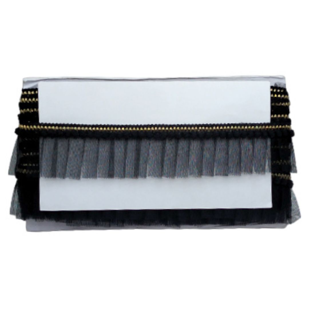 Black and gold clutch with a white interior on a white background