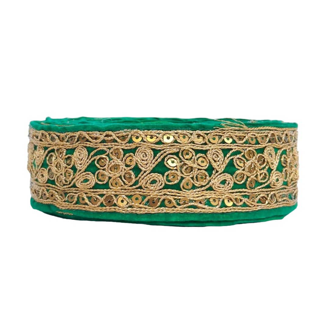 Green headband with gold lace and sequins on a white background