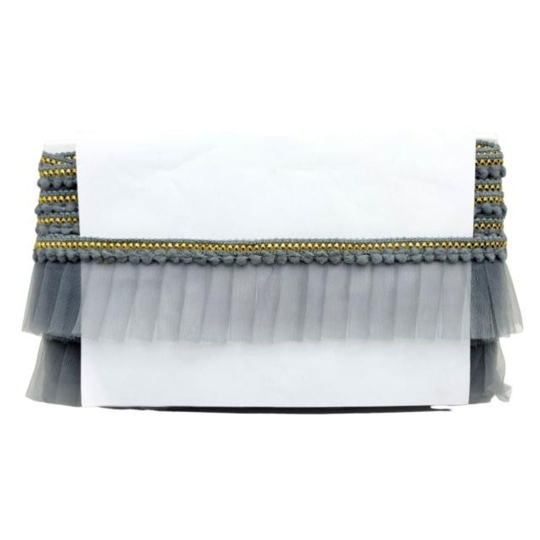 White clutch with gray tulle overlay and gold and gray beaded trim on a white background