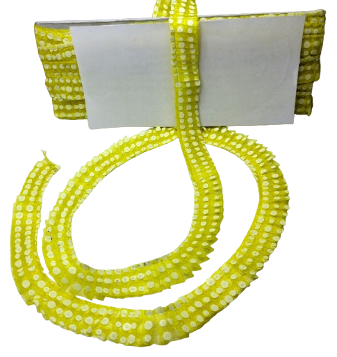 Yellow beaded lace with a white bow on a white background