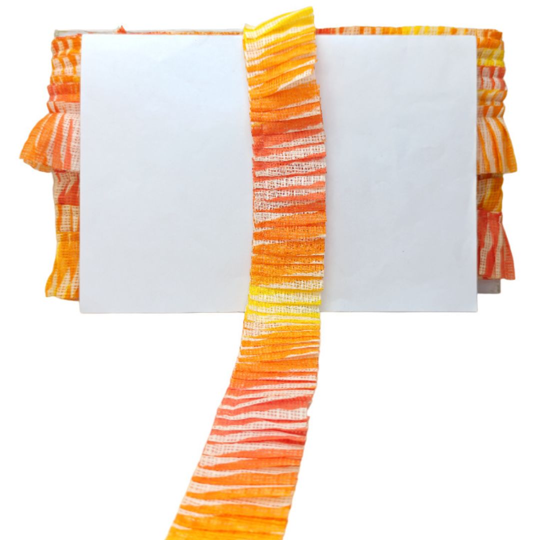 Striped orange and white fabric with a plain white center