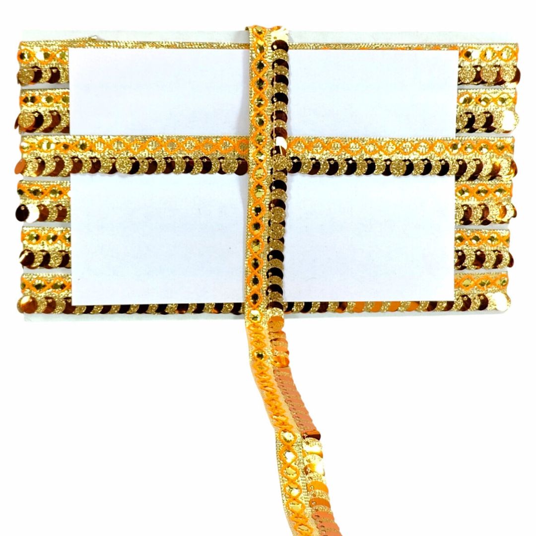 Decorative gold and black ribbon with beads on a white background