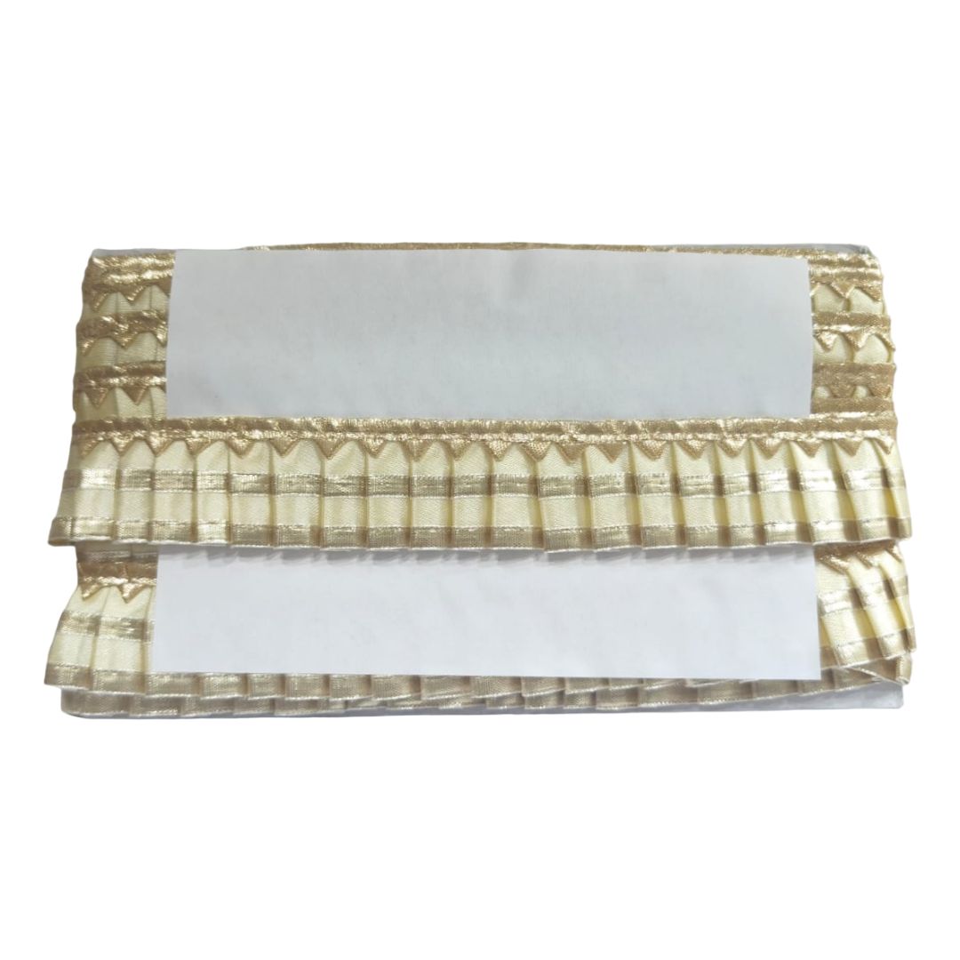Gold and white decorative valance on a white background