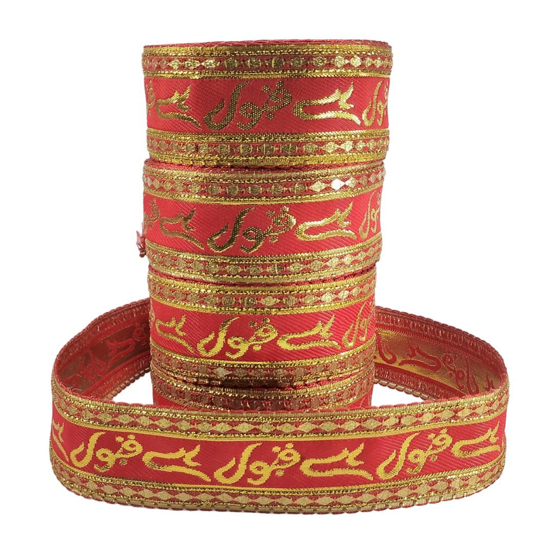 Red and gold bangles with intricate patterns on a white background