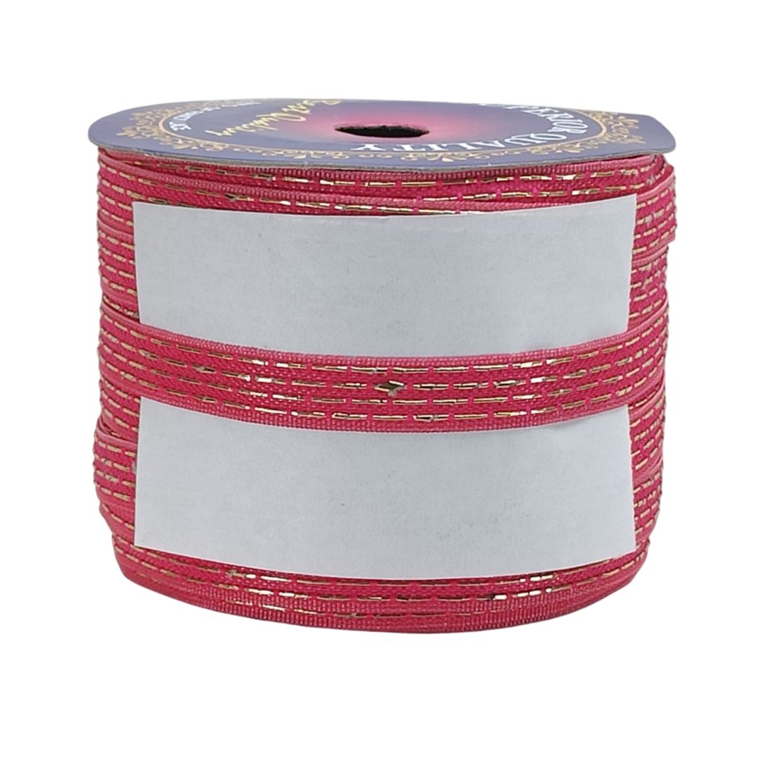Spool of pink ribbon with a white label on a white background