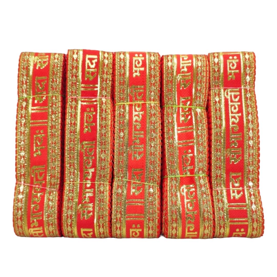 Red fabric with gold embroidery and text on a white background