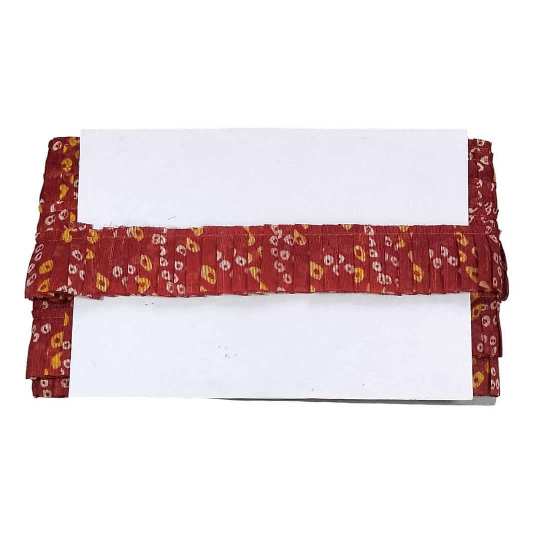 Red floral-patterned curtain valance on a white background