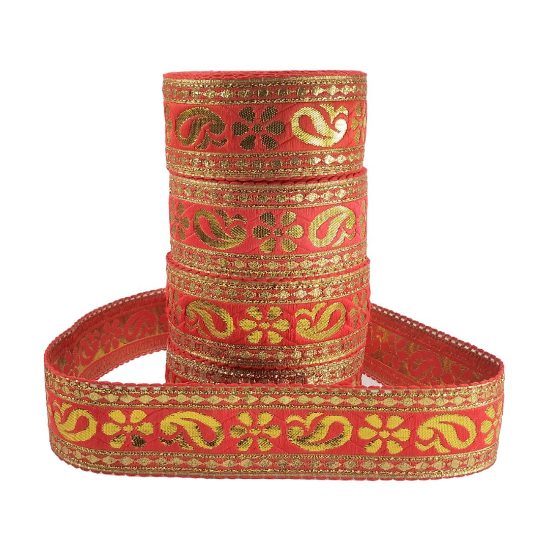 Red ribbon with gold patterns on a white background