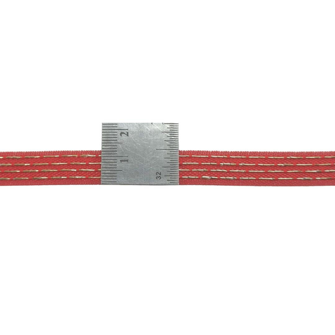 Red and gray braided cable with a measuring scale on a white background