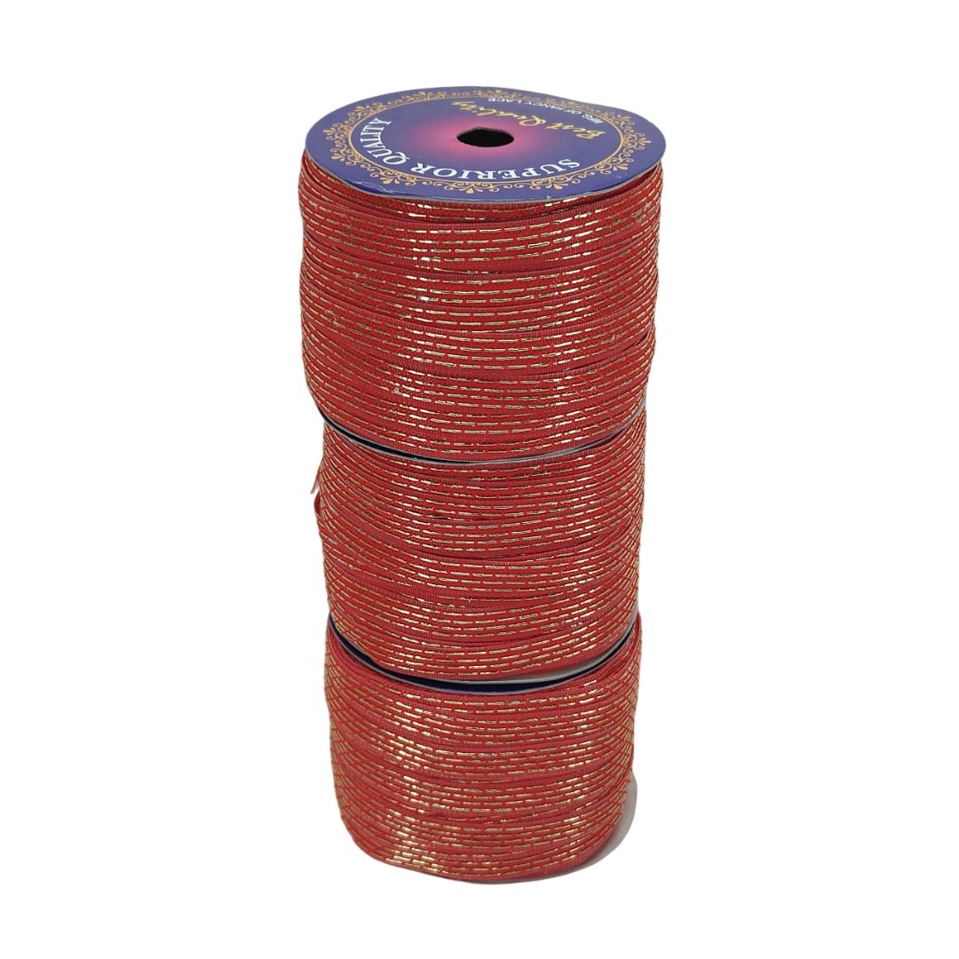 Red spool of ribbon with a blue label on a white background