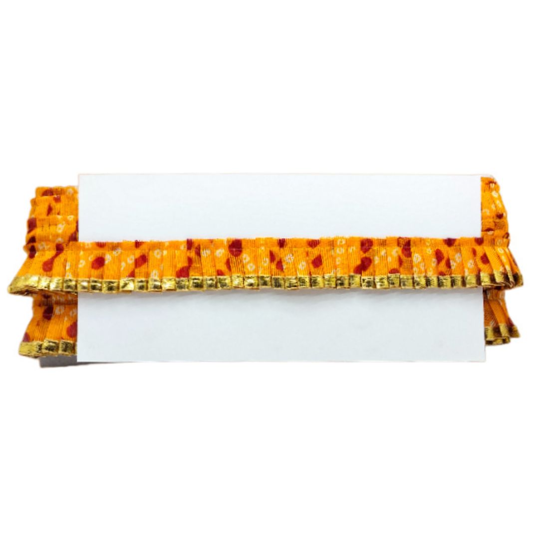 Orange and gold decorative item on a white background