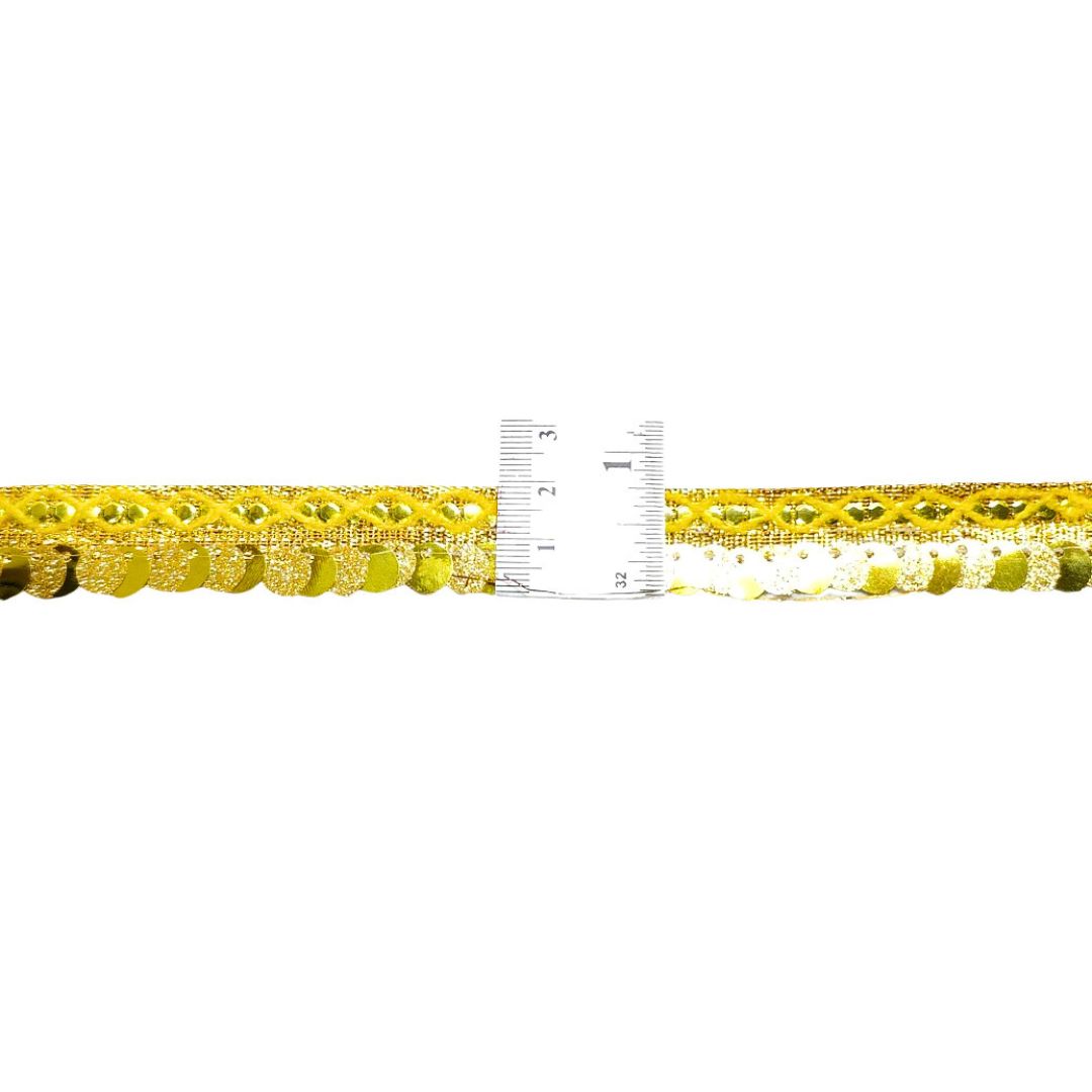 Yellow beaded ribbon with a ruler for measurement on a white background